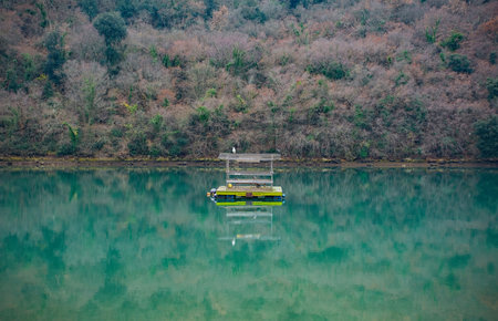 A floating platform in the Limski Kanal or Lim Channel in Istria, Croatia. Often described as the only fjord in south Europe, this coastal inlet is actually a ria, not a fjord, because its formation is not glacial in origin. Decemberの写真素材