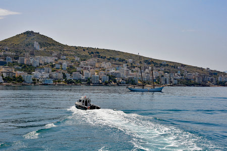 Sarande on the Ionian coastline of southern Albania, part of the Albanian Riviera. Here, the hills of the Ceraunian mountain range meet the Straits of Corfu in the eastern Mediterranean Seaの写真素材