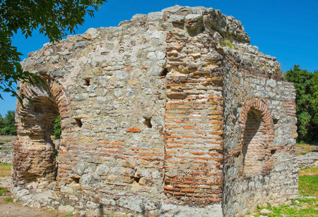 The remains of the 5th century Triconch Palace in Butrint Archaeological Park, within Butrint National Park, southern Albania. A UNESCO World Heritage Site. A late-Roman luxurious domestic complex built round peristyle courtyard. It was expanded during the Byzantine period, so has many Byzantine architectural featuresの写真素材