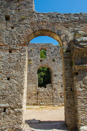 The early 6th century Byzantine Great Basilica in Butrint Archaeological Park, within Butrint National Park, southern Albania. A UNESCO World Heritage Site. Characterised by a central nave with side aisles separated by colonnades, a tripartite transept and a pentagonal apse which was hemispherical on its interior faceの写真素材