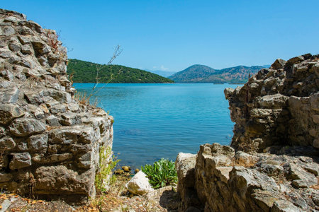 Late-antique and medieval walls on the shore of Lake Butrint in Butrint Archaeological Park, within Butrint National Park, southern Albania. A UNESCO World Heritage Siteの写真素材