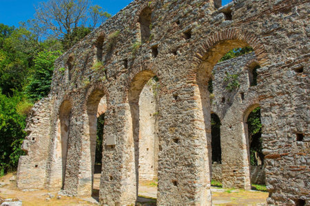 The early 6th century Byzantine Great Basilica in Butrint Archaeological Park, within Butrint National Park, southern Albania. A UNESCO World Heritage Site. Characterised by a central nave with side aisles separated by colonnades, a tripartite transept and a pentagonal apse which was hemispherical on its interior faceの写真素材