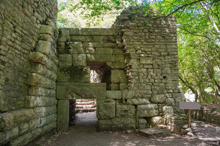 The Lion Gate in Butrint Archaeological Park, within Butrint National Park, southern Albania. A UNESCO World Heritage Site. An iconic feature of Butrint's fortifications, a Hellenistic-era entrance adorned with a lintel relief of a lion and a bullの写真素材
