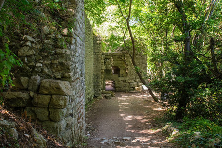 The Lion Gate in Butrint Archaeological Park, within Butrint National Park, southern Albania. A UNESCO World Heritage Site. An iconic feature of Butrint's fortifications, a Hellenistic-era entrance adorned with a lintel relief of a lion and a bullの写真素材