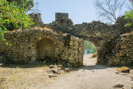 The Hellenistic Water Gate in Butrint Archaeological Park, within Butrint National Park, southern Albania. A UNESCO World Heritage Site. Also known as the Channel-Side City Wall, it was a major gateway. Originally built in the 6th century then rebuilt 13th-14th centuries when it was reduced to a smaller openingの写真素材