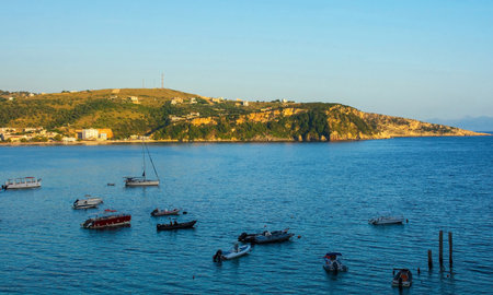 The end of the day in Himare on the coast of southern Albania, part of the Albanian Riviera. Located in Vlore County, it lies between the Ceraunian Mountains and the Ionian Sea and is a major tourism centreの写真素材