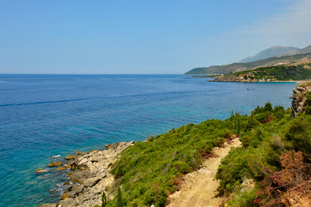 A view towards Livadhi Bay taken from the hills north of Himare on the coast of southern Albania, part of the Albanian Riviera. Located in Vlore County, it lies between the Ceraunian Mountains and the Ionian Sea and is a major tourism centreの写真素材