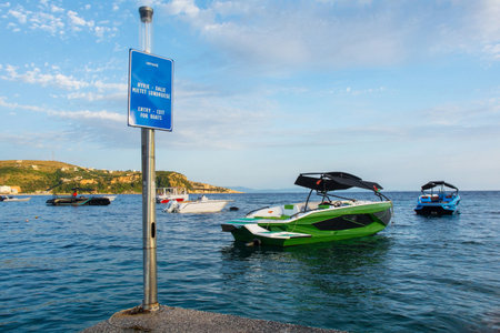 Boats at Spile Beach in Himare Bay on the coast of southern Albania, part of the Albanian Riviera. Located in Vlore County, it lies between the Ceraunian Mountains and the Ionian Sea and is a major tourism centreの写真素材