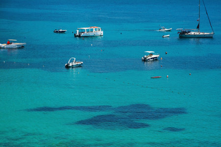 Boats in Himare Bay on the coast of southern Albania, part of the Albanian Riviera. Located in Vlore County, it lies between the Ceraunian Mountains and the Ionian Sea and is a major tourism centreの写真素材