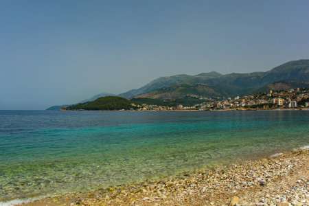 Potam Beach at the southern end of Himare Bay on the coast of south Albania, part of the Albanian Riviera. Looking towards the north of the bay. Located in Vlore County, Himare lies between the Ceraunian Mountains and the Ionian Sea and is a major tourism centreの写真素材