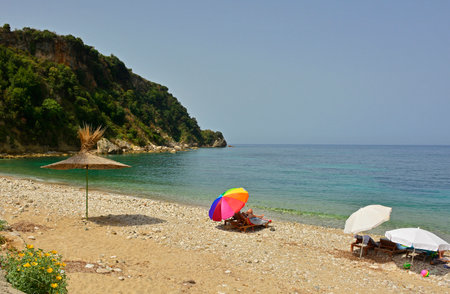 Potam Beach at the southern end of Himare Bay on the coast of south Albania, part of the Albanian Riviera. Located in Vlore County, it lies between the Ceraunian Mountains and the Ionian Sea and is a major tourism centreの写真素材