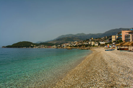 Potam Beach at the southern end of Himare Bay on the coast of south Albania, part of the Albanian Riviera. Looking towards the north of the bay. Located in Vlore County, Himare lies between the Ceraunian Mountains and the Ionian Sea and is a major tourism centreの写真素材