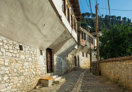 An historic house with half-timbered jettying overhanging a lane in the Gorica quarter of Berat in...
