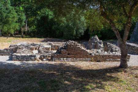 A Roman public bathhouse in Butrint Archaeological Park, within Butrint National Park, southern Albania. A UNESCO World Heritage Site. Located next to Venetian Tower, it features characteristic bathing rooms with remnants of a hypocaust system.の写真素材