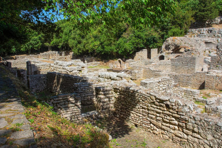 Ruins in the Roman Forum in Butrint Archaeological Park, within Butrint National Park, southern Albania. A UNESCO World Heritage Site. This was Butrint's civic centre, surrounded by administrative and commercial buildings, and including a marketplace, temples and a basilicaの写真素材