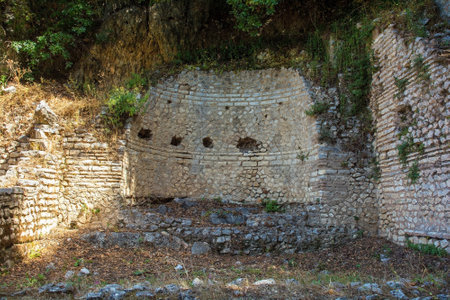 The ruins of a shrine in the north of the Roman Forum in Butrint Archaeological Park, within Butrint National Park, southern Albania. A UNESCO World Heritage Site. This was Butrint's civic centre, surrounded by administrative and commercial buildings, and including a marketplace, temples and a basilicaの写真素材