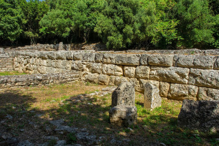 The ruins of walls in the Roman Forum in Butrint Archaeological Park, within Butrint National Park, southern Albania. A UNESCO World Heritage Site. This was Butrint's civic centre, surrounded by administrative and commercial buildings, and including a marketplace, temples and a basilicaの写真素材