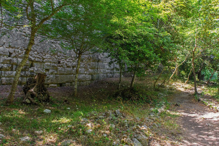 An historic stone wall in Butrint Archaeological Park, within Butrint National Park, southern Albania. Located near to the Colombarium. A UNESCO World Heritage Site.の写真素材