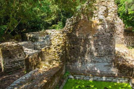 Ruins in Butrint Archaeological Park, within Butrint National Park, southern Albania. Located near to the Great Basilica. A UNESCO World Heritage Site.の写真素材