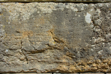 A wall with Hellenic inscriptions in Butrint Archaeological Park, within Butrint National Park, southern Albania. A UNESCO World Heritage Site. Known as the Tower of Inscriptions and dating back to 1st or 2nd century BC, it was originally part of a defensive tower. The Greek inscriptions relate to decrees issued by the highest authoritiesの写真素材