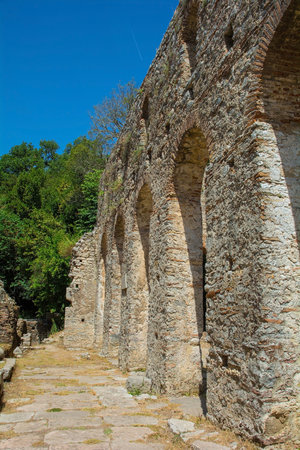 The early 6th century Byzantine Great Basilica in Butrint Archaeological Park, within Butrint National Park, southern Albania. A UNESCO World Heritage Site. Characterised by a central nave with side aisles separated by colonnades, a tripartite transept and a pentagonal apse which was hemispherical on its interior faceの写真素材
