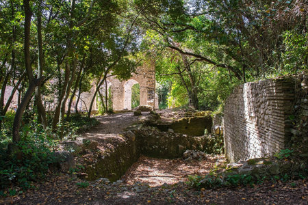 Ruins in Butrint Archaeological Park, within Butrint National Park, southern Albania. The early 6th century Byzantine Great Basilica is seen in the background. A UNESCO World Heritage Site.の写真素材