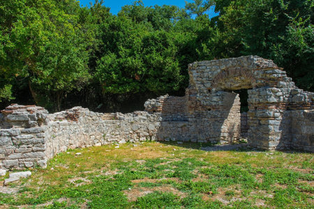 The remains of the 5th century Triconch Palace in Butrint Archaeological Park, within Butrint National Park, southern Albania. A UNESCO World Heritage Site. A late-Roman luxurious domestic complex built round peristyle courtyard. It was expanded during the Byzantine period, so has many Byzantine architectural featuresの写真素材