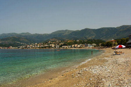 Potam Beach at the southern end of Himare Bay on the coast of south Albania, part of the Albanian Riviera. Looking towards the north of the bay. Located in Vlore County, Himare lies between the Ceraunian Mountains and the Ionian Sea and is a major tourism centreの写真素材