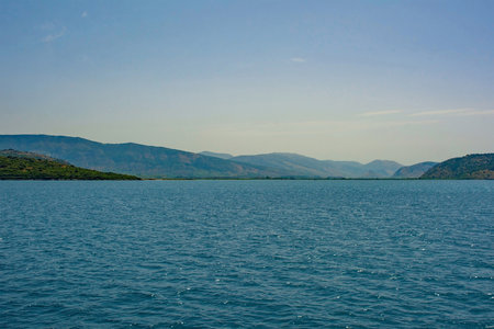 The Ionian coastline near Ksamil, part of the Albanian Riviera. Here, the green hills of the Ceraunian mountain range meet the Straits of Corfu in the eastern Mediterranean Seaの写真素材