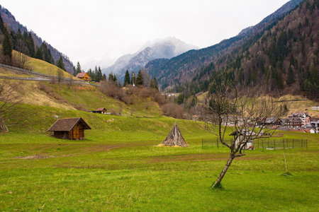 The early spring landscape around the village of Forni Avoltri in Val Degano valley in Carnia, Udine Province, Friuli-Venezia Giulia, north east Italyの写真素材