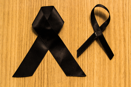 Two Mourning ribbon on his chest for Thai king mourning sign.の写真素材