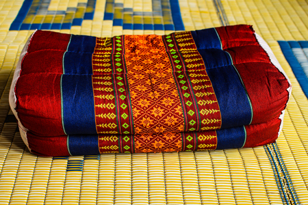 Thailand old backrest pillow on matの写真素材