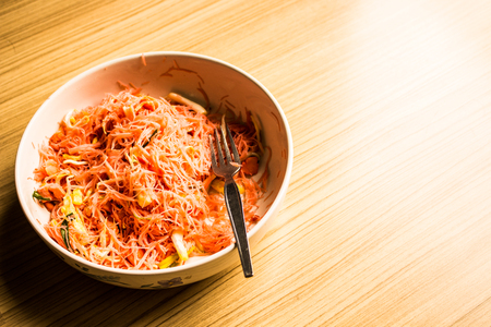 Fried noodle in a bowl of pink at home.の写真素材
