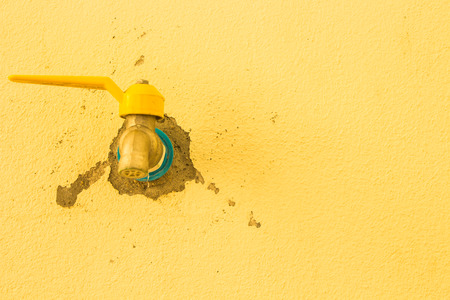Tap on the left side by a wall as a background.の写真素材