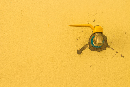 Tap on the right side by a wall as a background.の写真素材