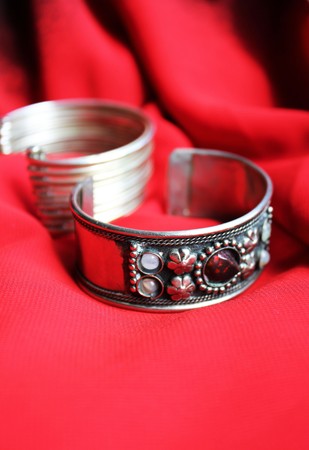 bracelet on a red silky backgroundの写真素材