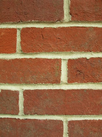 a close up of a red brick wall