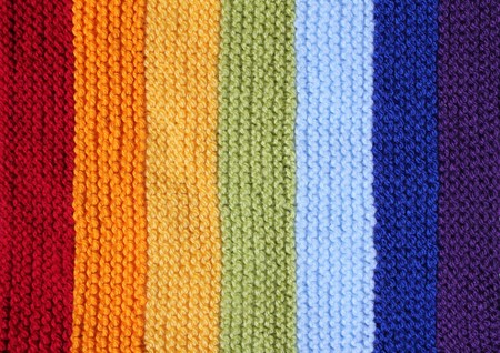 a knitted background in rainbow coloursの写真素材