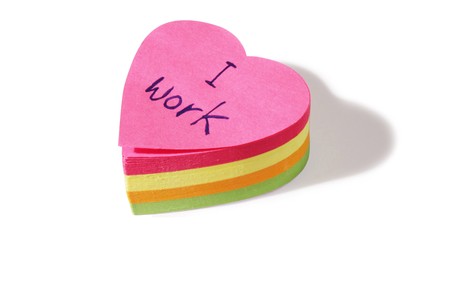 heart shaped post it notes cut out on a white backgroundの写真素材