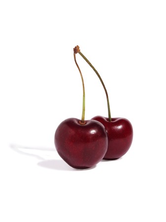 two cherries on a white backgroundの写真素材