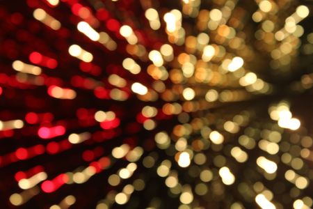 a beautiful abstract light star burst in red and goldの写真素材