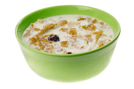 Bowl of cereal with milk isolated on white background