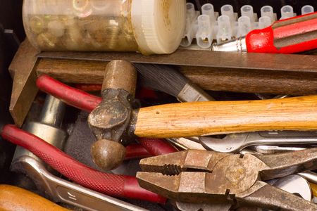 Closeup of the tools in a messy toolbox