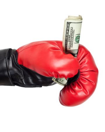 Boxing glove holding dollar bills isolated on white backgroundの写真素材