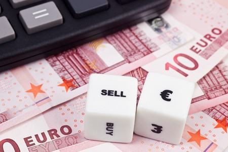 Euro currency with calculator and diceの写真素材
