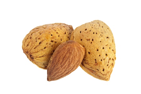 Shelled and unshelled almonds isolated on white backgroundの写真素材