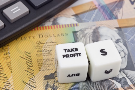 Australian currency with calculator and dice showing TAKE PROFITの写真素材