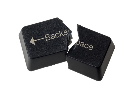 Backspace button cut in half depicting no undo isolated on white backgroundの写真素材
