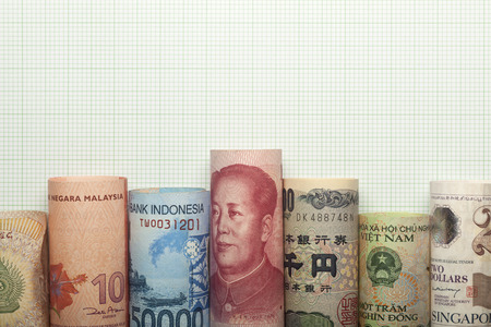 Asian currencies forming a graph against grid backgroundの写真素材