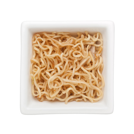 Stir fried noodle in a square bowl isolated on white background
の写真素材